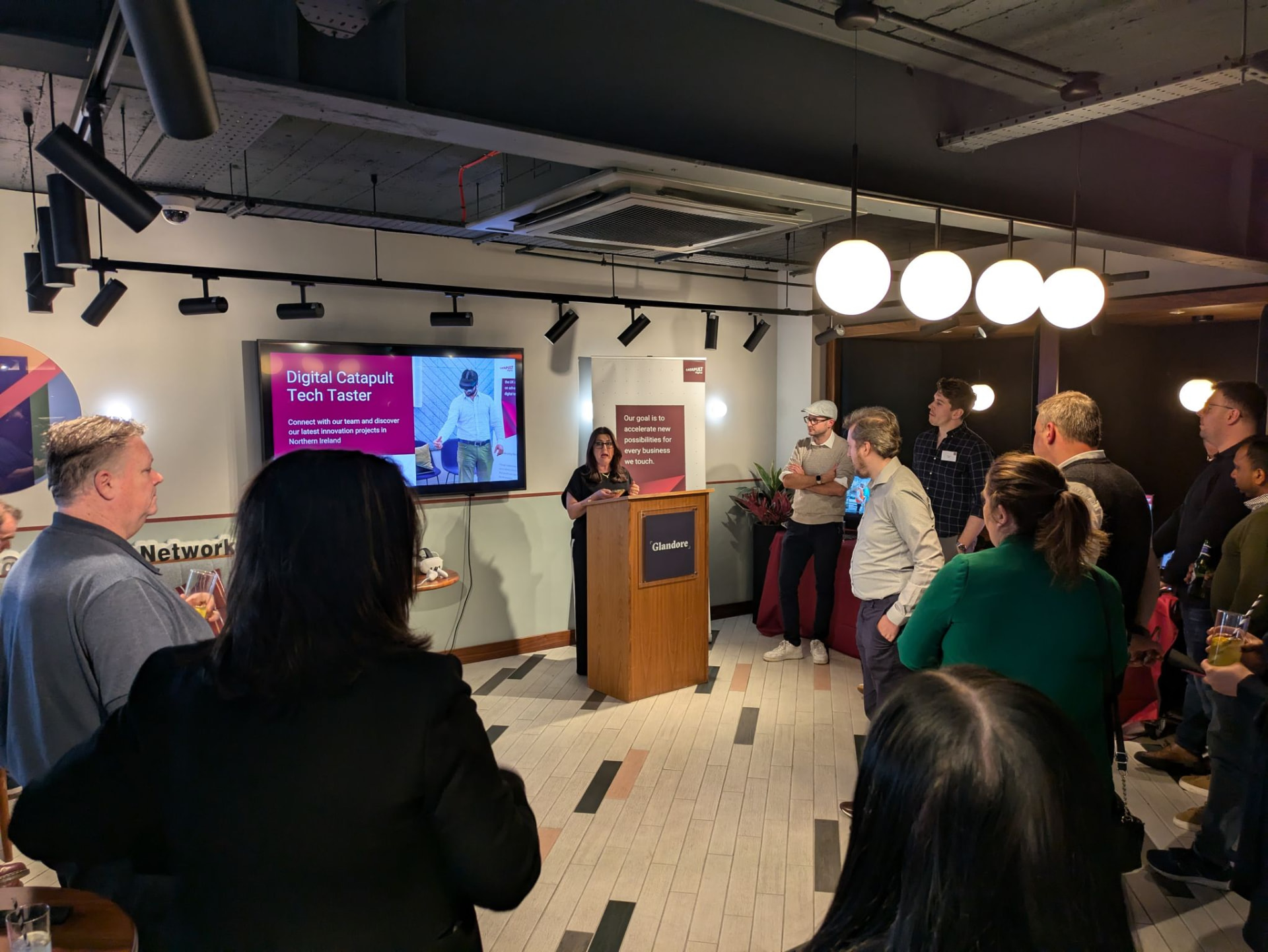 A speaker presenting the Digital Catapult Tech Taster to a packed room