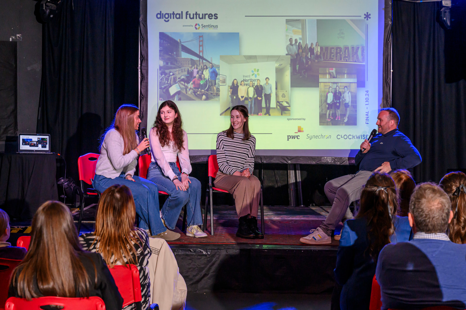 Young people speaking on stage at the Digital Futures final